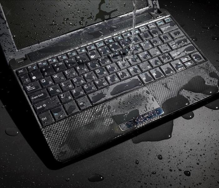Water on a laptop. 